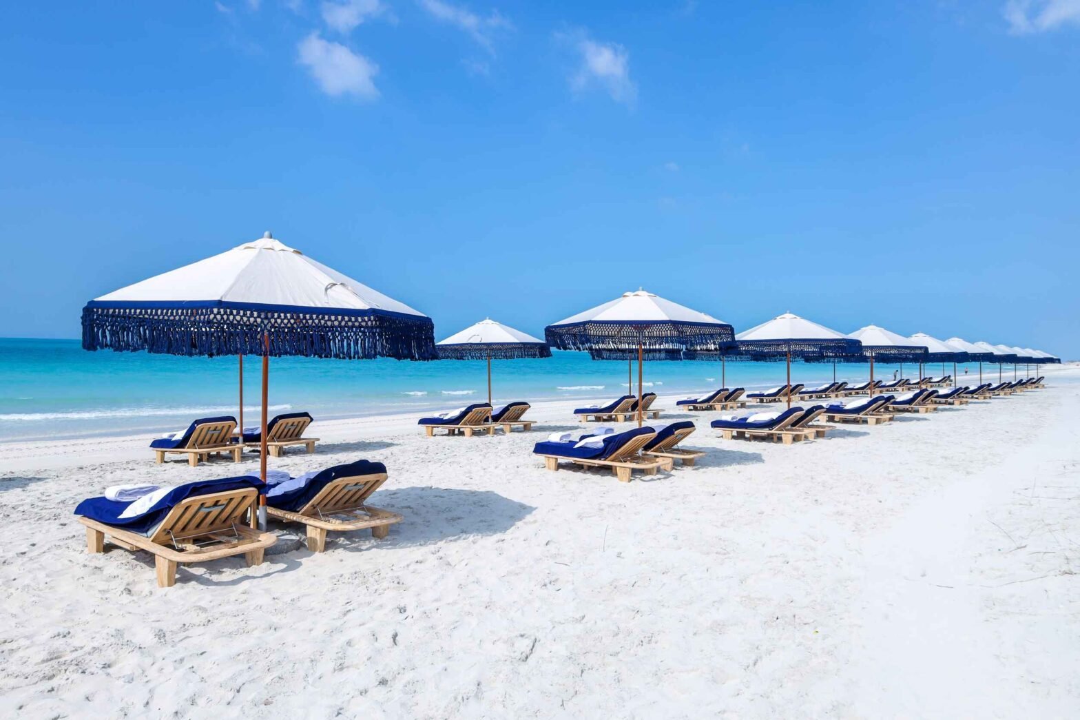 Beautiful sandy beaches with clear blue water, scenic coastlines, and relaxing seaside views.